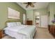 Spacious bedroom with ensuite bathroom access at 3457 Foxhall Dr, Holiday, FL 34691