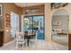 Kitchen breakfast nook with white table and chairs at 3457 Foxhall Dr, Holiday, FL 34691