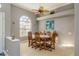 Bright dining room featuring a wood table and chairs at 3457 Foxhall Dr, Holiday, FL 34691