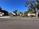 House exterior with a red door and palm trees in the front yard at 3457 Foxhall Dr, Holiday, FL 34691