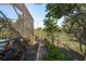 Landscaped garden path with various plants and trees at 3457 Foxhall Dr, Holiday, FL 34691