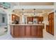 Modern kitchen with granite counters and wood cabinets at 3457 Foxhall Dr, Holiday, FL 34691