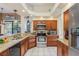 Spacious kitchen with granite countertops and stainless steel appliances at 3457 Foxhall Dr, Holiday, FL 34691