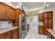 Kitchen features stainless steel refrigerator and granite countertops at 3457 Foxhall Dr, Holiday, FL 34691
