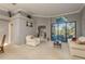 Living room with a comfy sofa and view of the pool at 3457 Foxhall Dr, Holiday, FL 34691