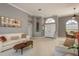 Spacious living room with neutral color palette and natural light at 3457 Foxhall Dr, Holiday, FL 34691