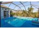 Large screened pool with plenty of space for relaxation at 3457 Foxhall Dr, Holiday, FL 34691