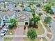 Two-story home with brick paver driveway and landscaped yard at 5230 Admiral Pointe Dr, Apollo Beach, FL 33572