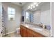Bathroom with granite countertop, wood cabinets, and updated fixtures at 5230 Admiral Pointe Dr, Apollo Beach, FL 33572