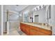 Double vanity bathroom with large walk-in shower at 5230 Admiral Pointe Dr, Apollo Beach, FL 33572