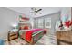Spacious bedroom with wood-look floors and ceiling fan at 5230 Admiral Pointe Dr, Apollo Beach, FL 33572