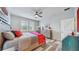 Charming bedroom with wood-look floors and ceiling fan at 5230 Admiral Pointe Dr, Apollo Beach, FL 33572