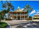 Community clubhouse with two stories, balconies, and palm trees at 5230 Admiral Pointe Dr, Apollo Beach, FL 33572