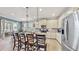 Bright kitchen with island seating and access to patio at 5230 Admiral Pointe Dr, Apollo Beach, FL 33572