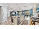 Open concept kitchen with island and views to backyard pool at 5230 Admiral Pointe Dr, Apollo Beach, FL 33572