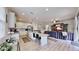 Modern kitchen with white cabinets, an island, and a breakfast bar at 5230 Admiral Pointe Dr, Apollo Beach, FL 33572
