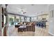 Open living and kitchen area with a large sectional sofa and hardwood floors at 5230 Admiral Pointe Dr, Apollo Beach, FL 33572