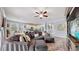 Comfortable living room with sectional sofa, hardwood floors, and ceiling fan at 5230 Admiral Pointe Dr, Apollo Beach, FL 33572