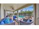 Covered patio with wicker furniture overlooking the pool and spa at 5230 Admiral Pointe Dr, Apollo Beach, FL 33572