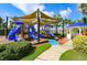 playground with slides, shade structures, and a gazebo at 5230 Admiral Pointe Dr, Apollo Beach, FL 33572