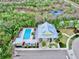 Community pool with lounge chairs and clubhouse at 5230 Admiral Pointe Dr, Apollo Beach, FL 33572