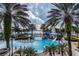 Community resort-style pool with water features and a slide at 5230 Admiral Pointe Dr, Apollo Beach, FL 33572