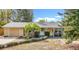 Cute yellow house with a blue porch and nicely landscaped yard at 5820 24Th S Ave, Gulfport, FL 33707