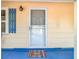 Front door with a colorful welcome mat at 5820 24Th S Ave, Gulfport, FL 33707