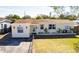 Charming ranch home with a well-maintained lawn and updated facade at 6554 34Th N Ave, St Petersburg, FL 33710