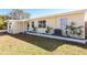 Light yellow ranch home with a neatly landscaped yard and updated exterior at 6554 34Th N Ave, St Petersburg, FL 33710