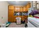 Laundry room with washer, dryer and storage at 6774 Treehaven Dr, Spring Hill, FL 34606