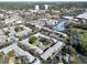 Aerial view of an apartment complex with a courtyard and ample parking at 6915 Avenue Des Palais # 2B, South Pasadena, FL 33707