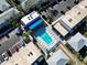 Community pool with surrounding patio and lounge chairs at 6915 Avenue Des Palais # 2B, South Pasadena, FL 33707