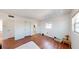 Spacious bedroom with wood flooring and access to bathroom at 6915 Avenue Des Palais # 2B, South Pasadena, FL 33707