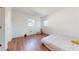 Bright bedroom with wood-look floors and ample natural light at 6915 Avenue Des Palais # 2B, South Pasadena, FL 33707