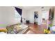 Bedroom with wood-look flooring, a closet, and a large window at 6915 Avenue Des Palais # 2B, South Pasadena, FL 33707