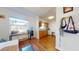 Bright kitchen with wood cabinets, laminate flooring, and stainless steel appliances at 6915 Avenue Des Palais # 2B, South Pasadena, FL 33707