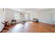 Spacious living room with hardwood floors and natural light at 6915 Avenue Des Palais # 2B, South Pasadena, FL 33707