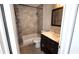 Clean bathroom, featuring a bathtub and vanity with quartz countertop at 7298 Ulmerton Rd # 202, Largo, FL 33771