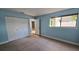 Bright bedroom with tiled floors and double door closet at 7298 Ulmerton Rd # 202, Largo, FL 33771