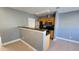 Kitchen boasts wood cabinets and stainless steel appliances at 7298 Ulmerton Rd # 202, Largo, FL 33771