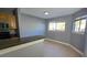 Kitchen with wood cabinets, granite countertops, and stainless steel appliances at 7298 Ulmerton Rd # 202, Largo, FL 33771
