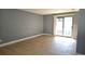 Spacious living room with tile floors and sliding glass doors at 7298 Ulmerton Rd # 202, Largo, FL 33771