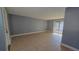Living room with tile floors and sliding glass doors at 7298 Ulmerton Rd # 202, Largo, FL 33771