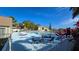 Community pool with lounge chairs and patio tables at 7298 Ulmerton Rd # 202, Largo, FL 33771