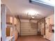 Spacious garage with overhead storage and built-in cabinets at 8360 Candlewood Rd, Seminole, FL 33777