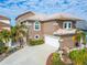Two-story house with attached garage and landscaping; located in a waterfront community at 861 Symphony Isles Blvd, Apollo Beach, FL 33572