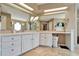 Elegant bathroom with double sinks and a large soaking tub at 861 Symphony Isles Blvd, Apollo Beach, FL 33572