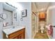 Basement bathroom with shower and granite vanity at 861 Symphony Isles Blvd, Apollo Beach, FL 33572