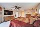 Large bedroom with a king-size bed and large TV at 861 Symphony Isles Blvd, Apollo Beach, FL 33572